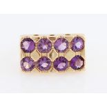 An amethyst ring, set with eight round cut amethysts in rectangular shaped head, stamped 14k, ring