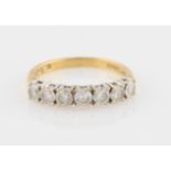 An 18ct yellow gold seven stone diamond half eternity ring, set with seven round brilliant cut