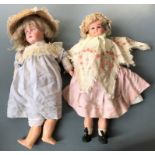 Two dolls, one marked 476 S W with bisque head, one with cloth body.