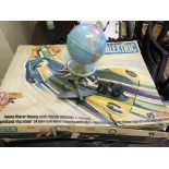 A Tri-ang scalextric with racing games together with model plane and globe.