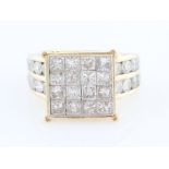 A diamond dress ring, set with sixteen princess cut diamonds in square shaped raised head, with