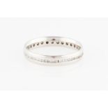 A platinum diamond full eternity ring, channel set with round brilliant cut diamond accents,