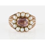 A 19th Century rose quartz and pearl ring, set centrally with an oval rose quartz, surrounded by a