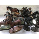 A selection of fifteen figurines including people on horseback, horses including Arkle and