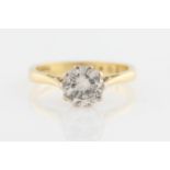 An 18ct yellow gold diamond solitaire ring, set with a round brilliant cut diamond, measuring