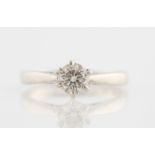 A platinum diamond solitaire ring, set with a round brilliant cut diamond, measuring approx. 0.50ct,