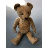 A hump back moving limb teddy bear.