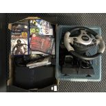 A PlayStation 2 together with several games and a steering wheel.