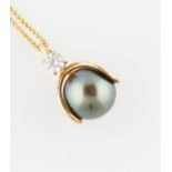 A Tahitian pearl and diamond pendant, set with a Tahitian pearl diameter approx. 10mm, surmounted by