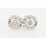 A pair of 18ct white gold diamond stud earrings, each set with a round brilliant cut diamond,