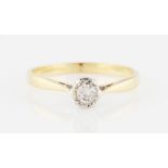 A diamond solitaire ring, bezel set with a round brilliant cut diamond, measuring approx. 0.30ct,