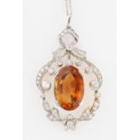 A Belle Époque style citrine and diamond pendant, set with a central oval cut citrine dropper,