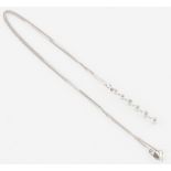 A six stone diamond pendant, the linear design set with six graduated round brilliant cut diamonds