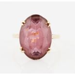 A 9ct yellow gold purple paste ring, hallmark rubbed, ring size Q½.