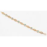 A zircon bracelet, featuring links of alternating open metalwork design, clasp stamped 9ct, length