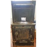 A cast iron back to back log burner oven and fire.