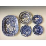A collection of assorted blue and white dinner ware to include serving plates, dishes and dinner