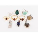 A collection of four gemstone set pendants, to include blue topaz, smoky quartz, rutilated quartz