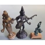 Bronze statue of the goddess Saraswati, with two other statues.