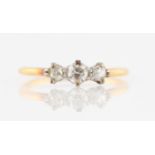 A three stone diamond ring, set with three graduated round brilliant cut diamonds, total diamond