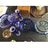 A selection of blue and amber bohemian glassware including rose bowl, four vases, an urn, bowl and