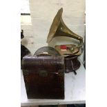 A reproduction gramaphone with brass horns and two boxes of 78 rpm records.