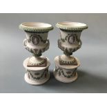 A pair of Wedgwood tricolour Jasper miniature urns, 17cm high.