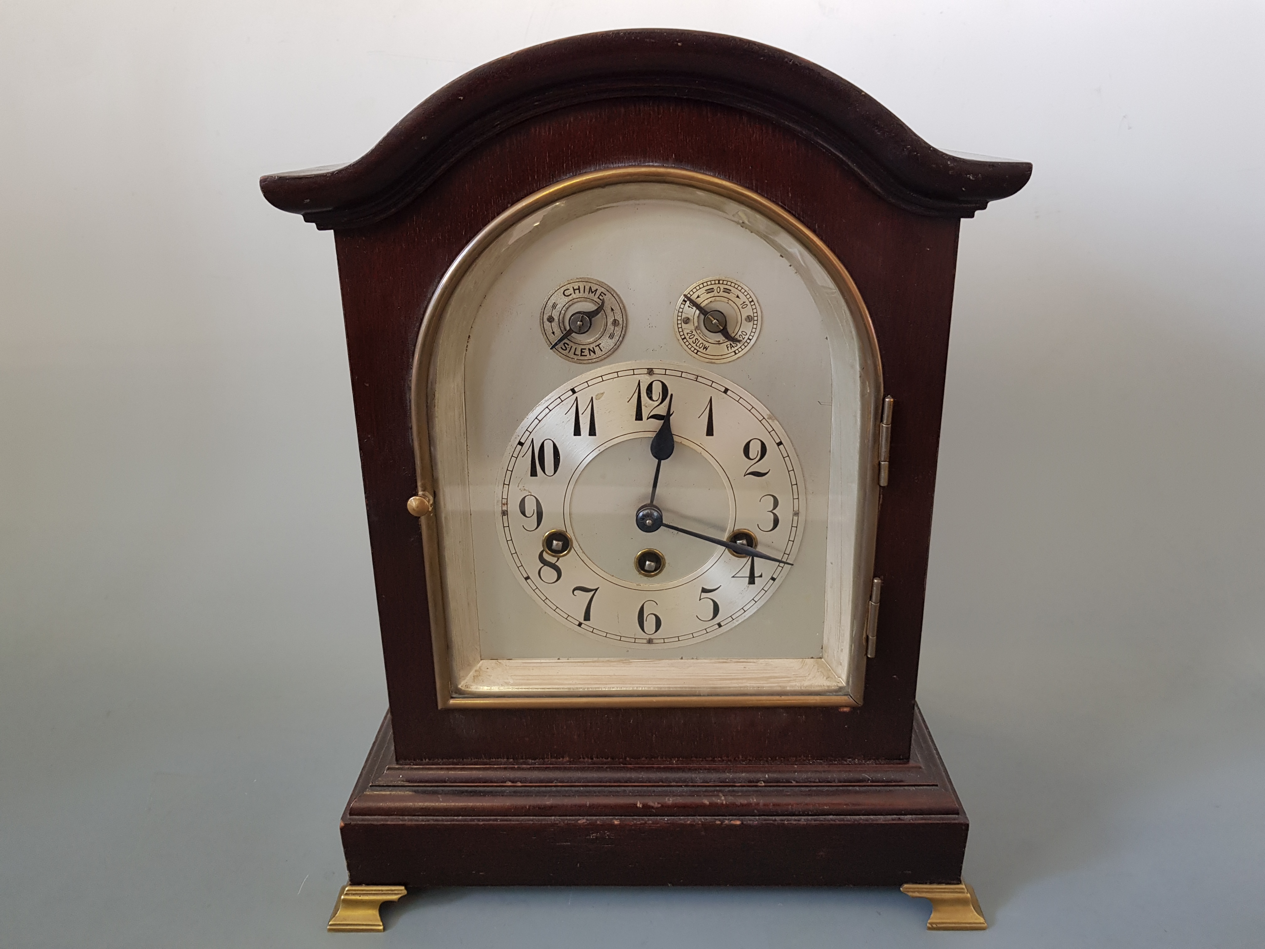 A mahogany cased bracket clock with silvered dial on gilt feet, name on back Wurtenberg B21 38cm