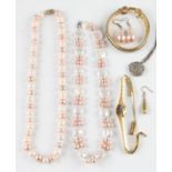 A lot to include two strings of freshwater pearls, a pair of earrings and a single earring, a