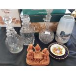 Royal Copenhagen vase, three glass decanters, one with a balls eye stopper, terrocater figure and