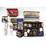 A large collection of costume jewellery to include a silver charm bracelet, a banded agate locket