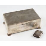 A silver cigarette box, of rectangular form with engine turned design, hallmarked Birmingham 1987,