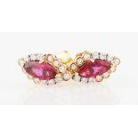 A pair of ruby and diamond cluster stud earrings, each set with a marquise cut ruby, surrounded by a