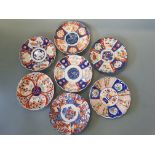 Seven imari decorated wall plates.