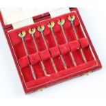 A set of six silver and enamel toothpicks, each terminal featuring an enameled cockerel,