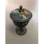 A cloisonne goblet with lid, floral decoration, blue ground, approximately 20 cm.