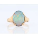 An opal doublet ring, set with an oval opal doublet measuring approx. 15x11mm, stamped 9ct, ring