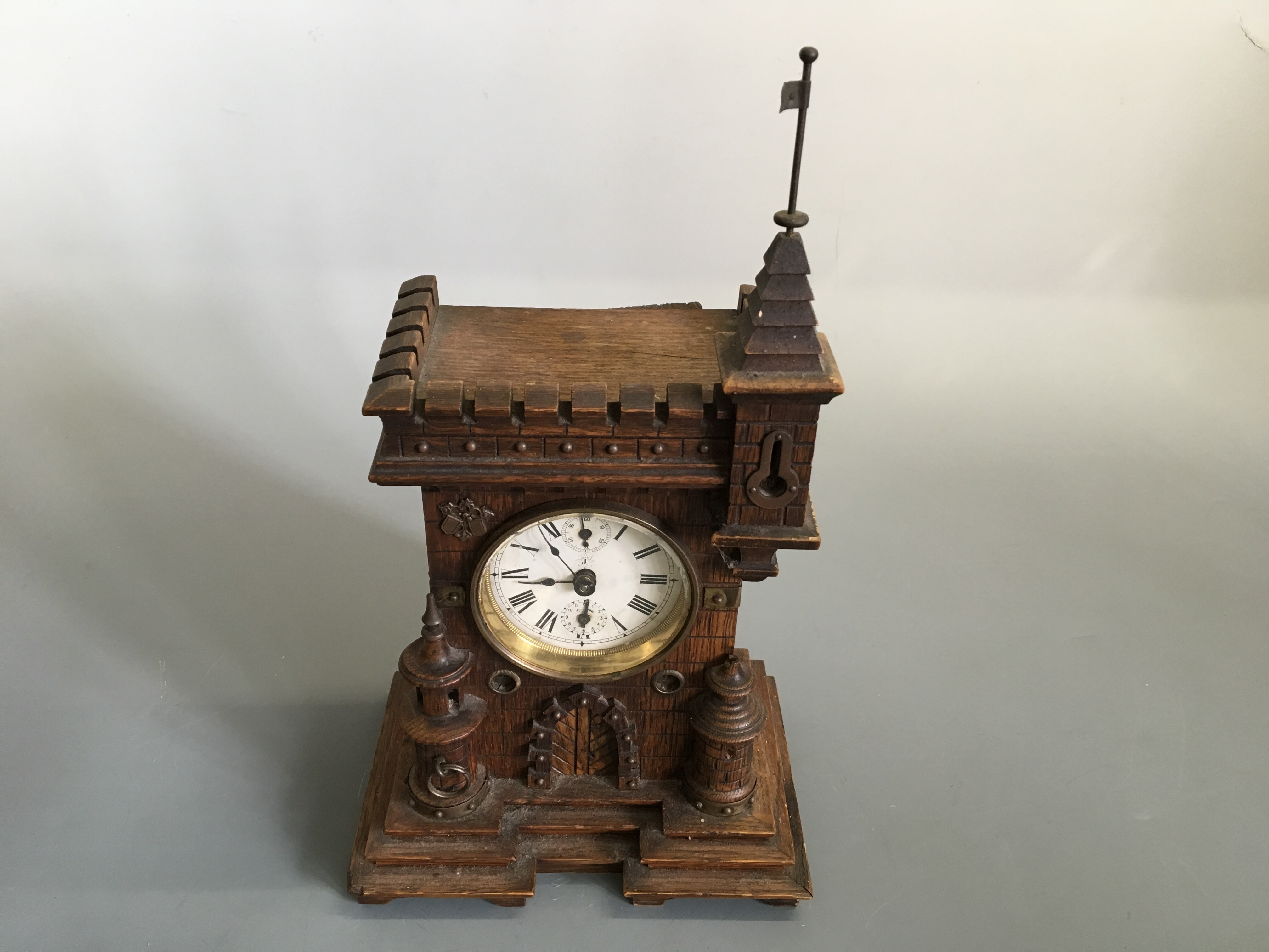 An oak castle torrit design mantle clock.