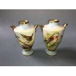 Two Aynsley hand painted urns, one with a wren, blackberry bush and the other with a Linnet,