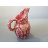 A pink and gold lustre jug marked to base, by L Castel Cannes Mont Chevalier, 21cm high.