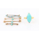 A collection of turquoise set jewellery to include a ring, three lace pins and a turquoise and