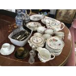 A floral decorated tea set, plates cups and and saucers, two blue German jugs and a collection of