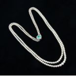 A matinee length double string of graduated pearls, largest diameter approx. 8mm, smallest approx.