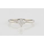 A single stone diamond ring, set with a round brilliant cut diamond measuring approx. 0.40ct, to a