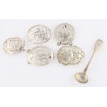 A collection of five white metal buckles, all of pierced floral design, two with oriental