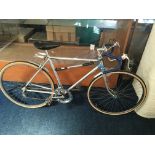 A gents sliver framed Raleigh drop handlebar racing bicycle