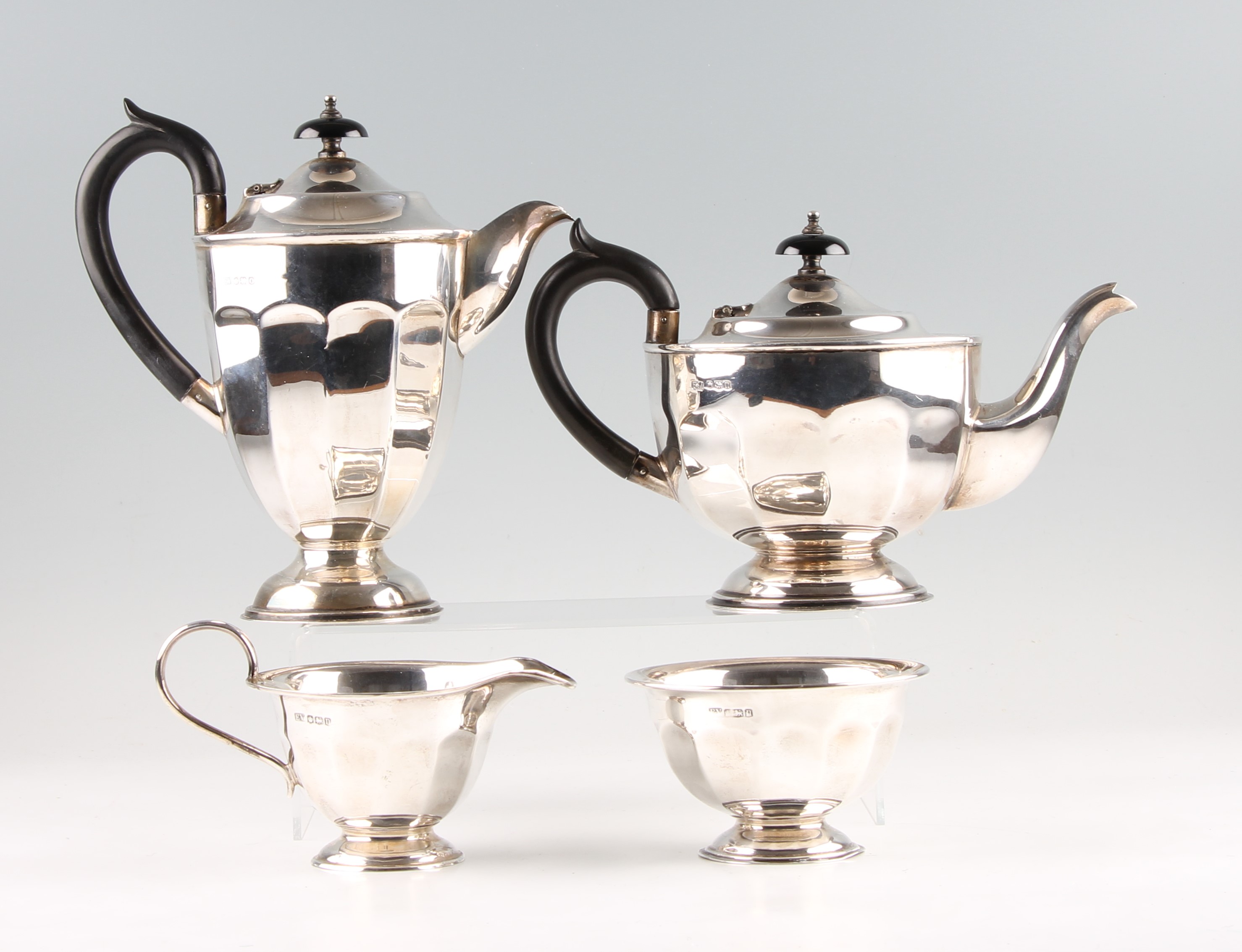 A 1930s silver tea set, comprising a tea pot, water pot, sugar bowl and milk jug, all hallmarked