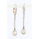 A pair of diamond drop earrings, each set with six bezel set eight-cut diamonds suspending an old