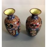 A pair of cloisonne vases with bird, dragon and floral decoration ( one has some damage),
