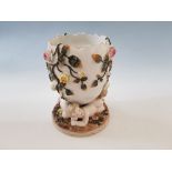 A Sitzendorf porcelain egg with cherubs and floral design.